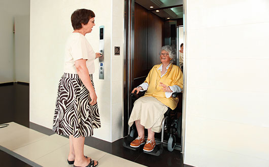 Karma Ergo Traveller powerchair in a elevator.