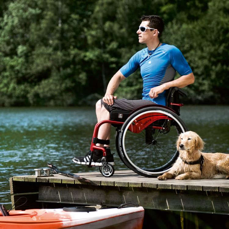Man using Argon 2 wheelchair on a lake dock
