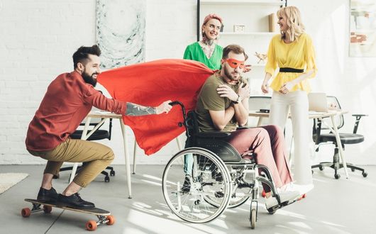 Adult in wheelchair dressed as a superhero