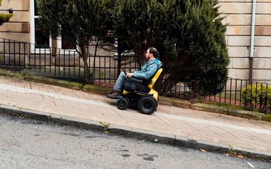 Man going up steep hill using Series 5 powerchair