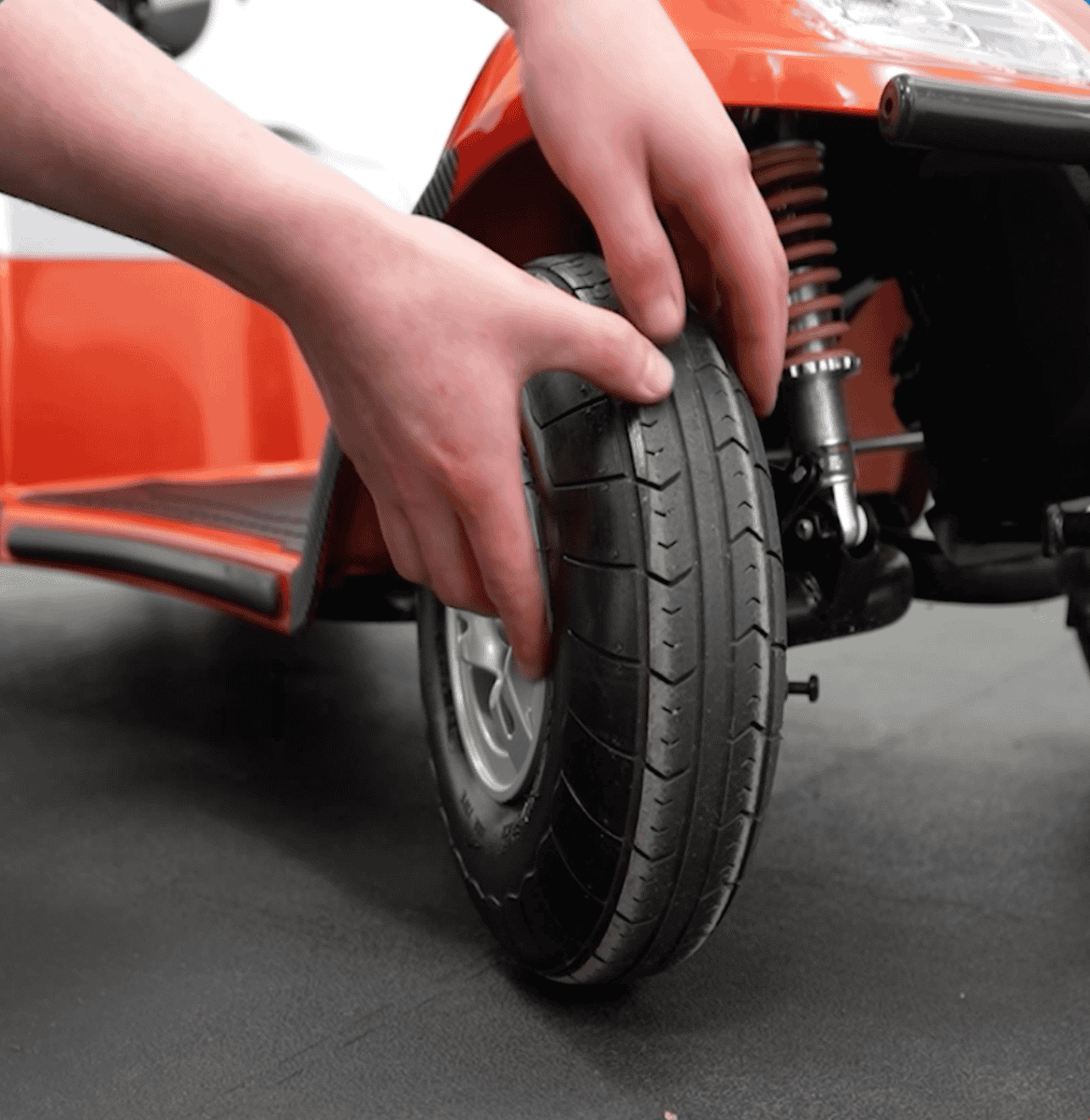 Checking the tyres on a mobility scooter