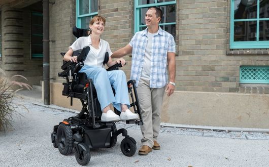 Woman using Morgan M powerchair outdoors