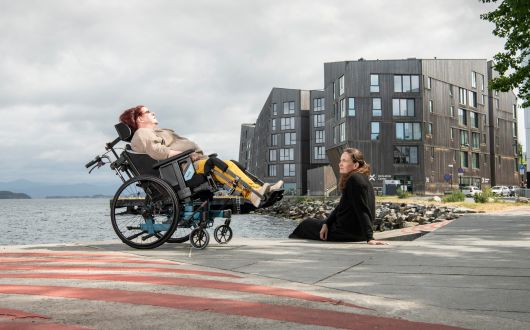 Woman using tilt-in-space feature Netti V wheelchair