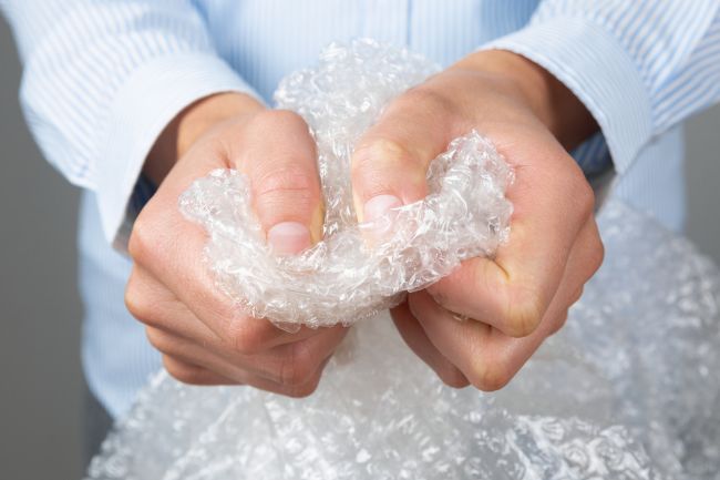 Person holding bubble wrap.