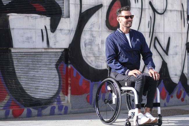 Man using wheelchair outdoors