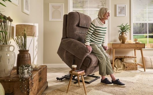 Woman using recliner lift to stand