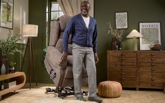 Man using recliner lift to stand