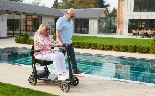 Woman using S50 beside pool.