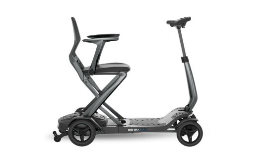 A modern black and grey Carbon Ultra Lite electric mobility scooter with a raised, ergonomic seat, four wheels, and a handlebar. The design appears lightweight and compact, suitable for both indoor and outdoor use.